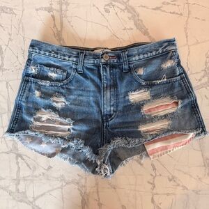 Hollister Distressed Blue Denim Women's Shorts with Flag Pockets Detail